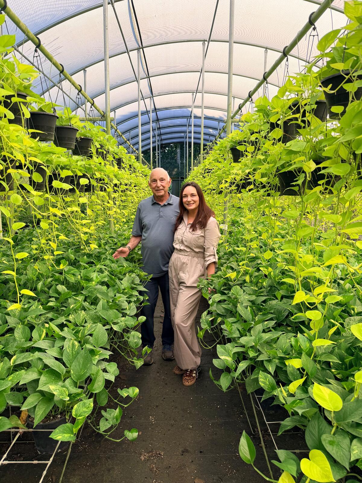 Mike Costa and family in the pothos greenhouse at The Lost Horizons Nursery